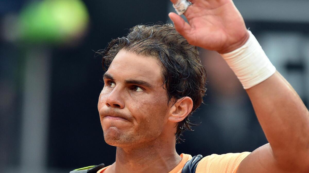 Rafael Nadal waves after losing to Novak Djokovic at in the Italian Open on May 13.