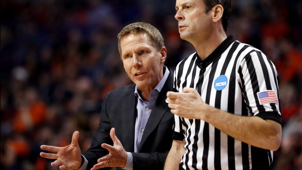 Gonzaga Coach Mark Few argues a call with an official during the second half of the Bulldogs' game against Syracuse in the Midwest Regional semifinal.