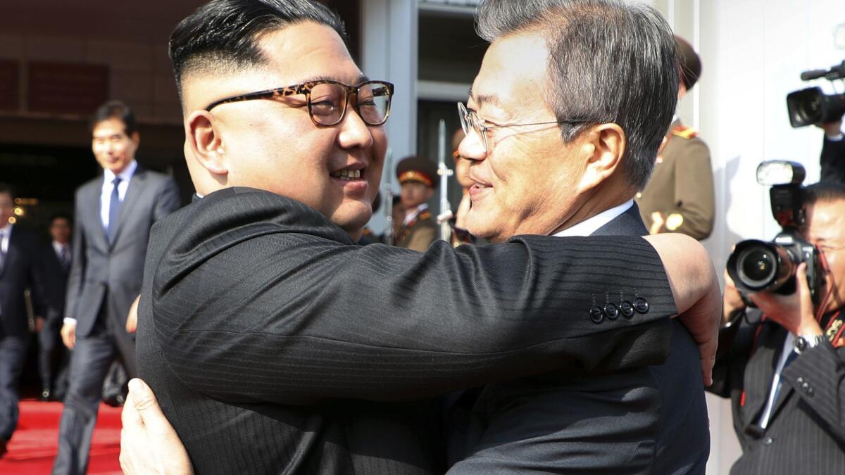 North Korean leader Kim Jong Un, left, and South Korean President Moon Jae-in embrace after their meeting in North Korea in May.