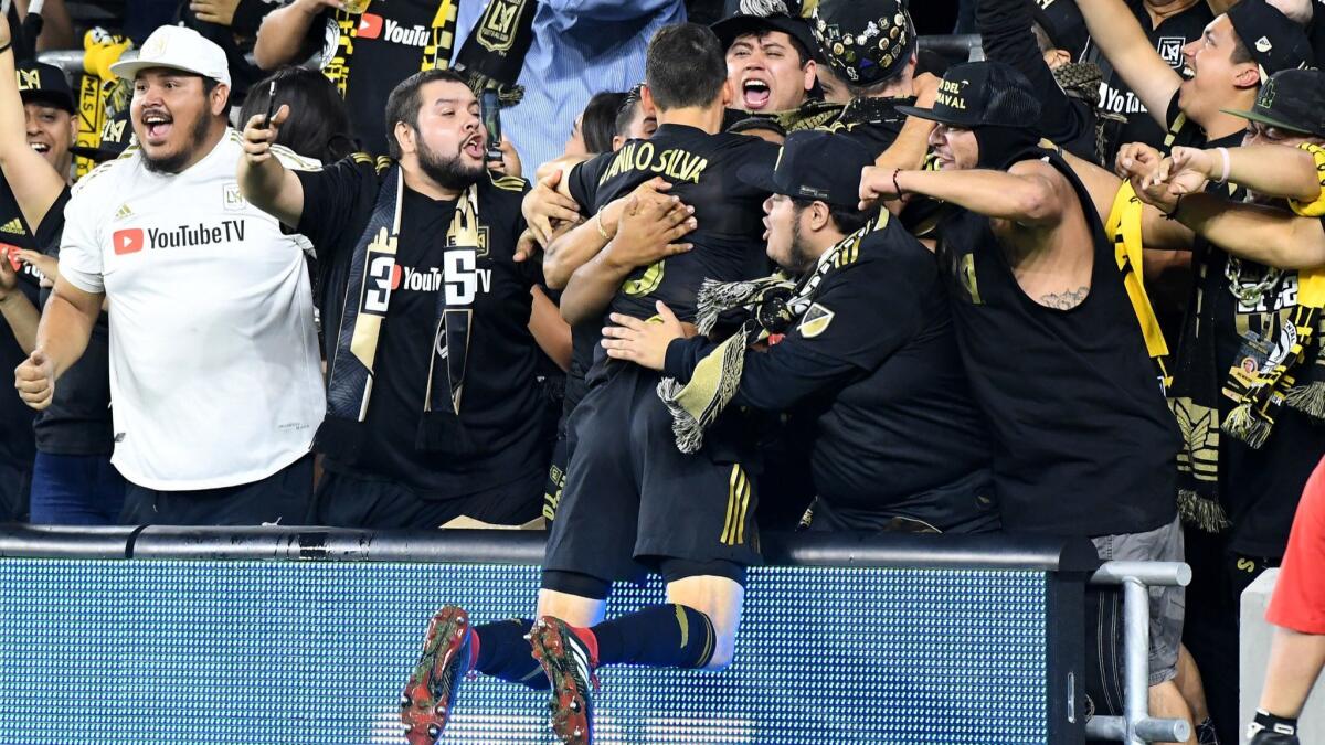 LAFC's Danilo Silva celebrates with fans after scoring in an MLS knockout-round playoff match against Real Salt Lake at Banc of California Stadium on Nov. 1. LAFC lost 3-2.