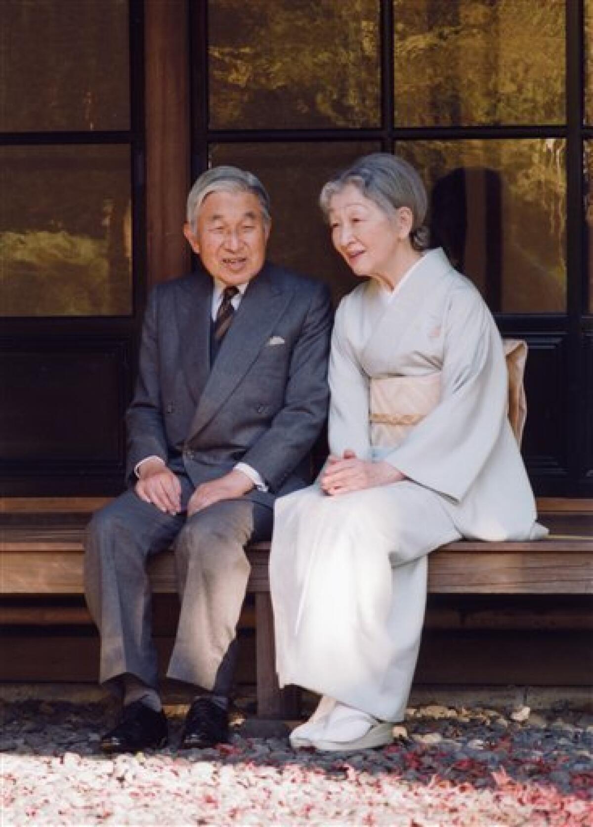 In this photo taken on Monday, Nov. 29, 2010 and released by the Imperial Household Agency of Japan, Emperor Akihito and Empress Michiko chat at Sokintei arbor during their stroll at Fukiage Garden in the Imperial Palace in Tokyo. Akihito celebrates his 77th birthday Thursday, Dec. 23, 2010. (AP Photo/Imperial Household Agency of Japan) EDITORIAL USE ONLY