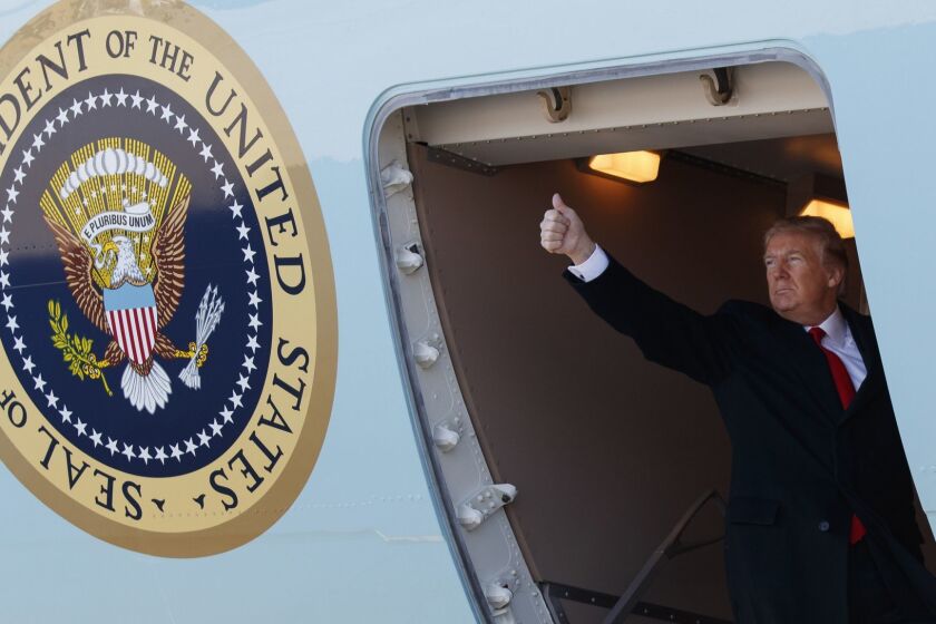 President Donald Trump boards Air Force One for a trip to California to view border wall prototypes, Tuesday, March 13, 2018, in Andrews Air Force Base, Md. Trump fired Secretary of State Rex Tillerson on Tuesday and said he would nominate CIA Director Mike Pompeo to replace him, in a major staff reshuffle just as Trump dives into high-stakes talks with North Korea. (AP Photo/Evan Vucci)