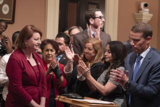 California state Senate President Pro Tempore Toni Atkins, of San Diego, left, is applauded by state Senate Democrats for her service at a news conference where state Sen. Mike McGuire, D-Healdsburg, right, was named to succeed Atkins as the new Senate Leader at the Capitol in Sacramento, Calif., Monday, Aug. 28, 2023. Atkins said McGuire will take over as Senate Leader sometime next year. (AP Photo/Rich Pedroncelli)