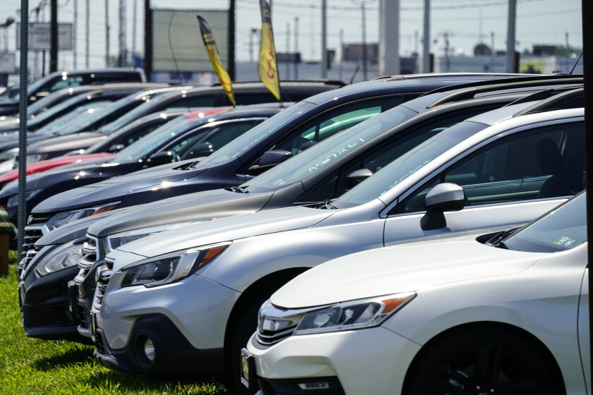 Used cars for sale are parked roadside at an auto lot in Philadelphia, Tuesday, July 12, 2022. On Wednesday, July 13, 2022, the Labor Department will report on U.S. consumer prices for June. (AP Photo/Matt Rourke)