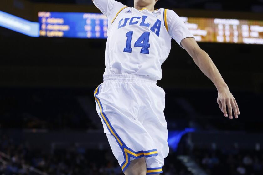 UCLA's Zach LaVine dunks during the Bruins' 83-60 win over Weber State on Sunday.