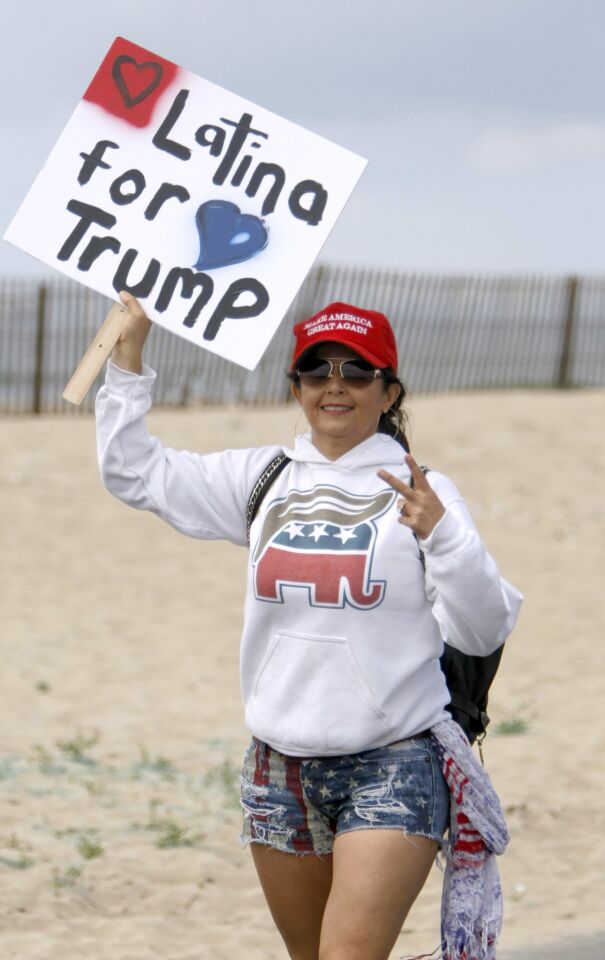 Natalie Curtis of Malibu brought this sign to the Make America Great Again March at Bolsa Chica State Beach in Huntington Beach on Saturday.