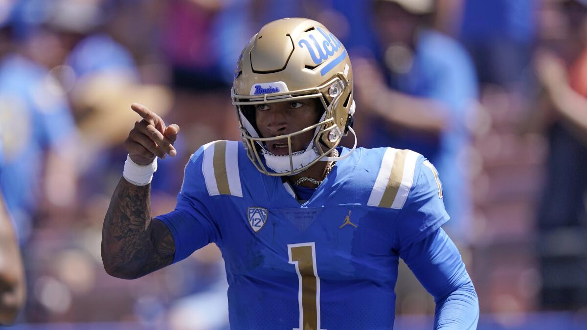 UCLA quarterback Dorian Thompson-Robinson gestures after scoring a touchdown against Bowling Green.