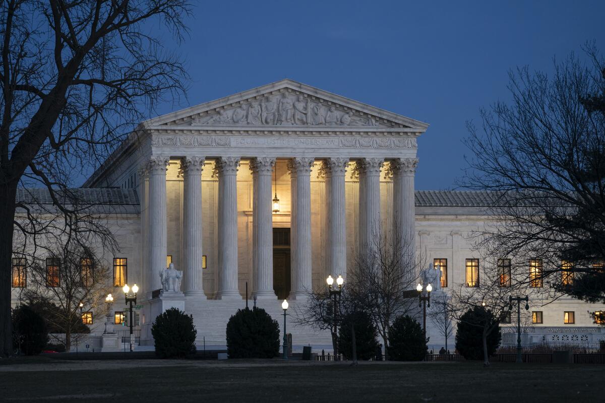 FILE - In this Jan. 22, 2020, file photo, night falls on the Supreme Court in Washington. 