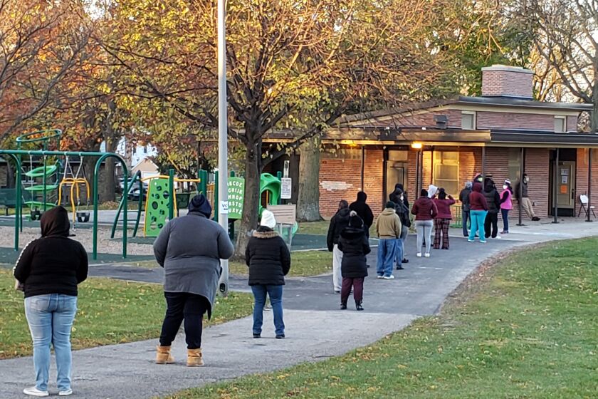 FILE - Voters wait in line outside a pavilion at Center Street Park shortly before the polling site opened on Election Day, Nov. 3, 2020, in Milwaukee. An audio recording of a strategy meeting obtained Thursday, Feb. 2, 2023, by The Associated Press shows, that the leaders of then-President Donald Trump's reelection campaign in battleground Wisconsin conceded privately the day after the 2020 election that he had lost, praising Democratic turnout efforts and focusing instead on spreading the lie that Democrats had stolen the election. (AP Photo/Rich Rovito, File)