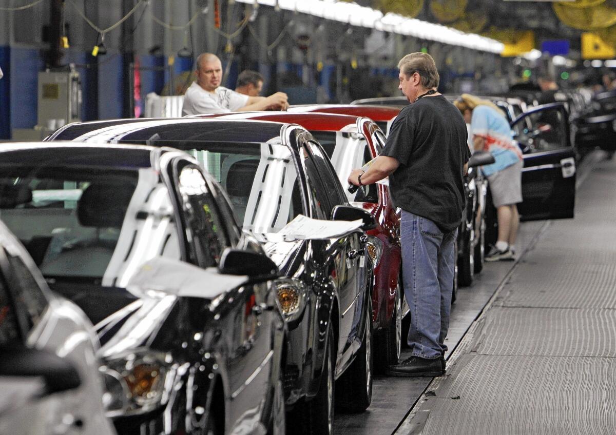 GM is contending with a pair of massive recalls totaling 1.6 million cars. The automaker has acknowledged to the National Highway Traffic Safety Administration that at least 12 deaths and 31 traffic accidents have been linked to its vehicles' faulty ignition switches. Above, workers at a GM plant in Ohio put final touches on Chevy Cobalts in 2010.