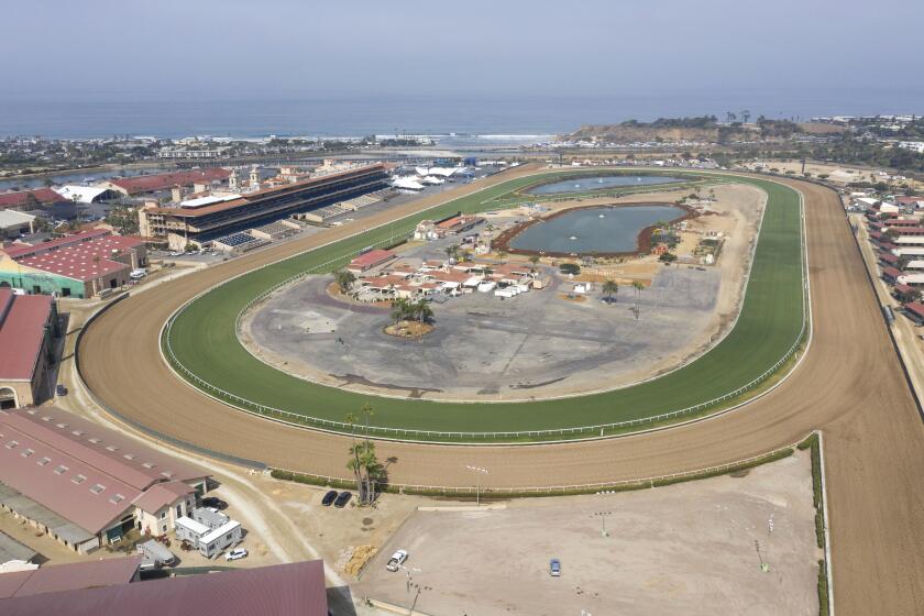 July 13, 2019, Del Mar, California_USA_| High angle view of the Del Mar Racetrack at 10:00 a.m. when the sun comes out and morning workouts on the track end. |_Photo Credit: Photo by Charlie Neuman