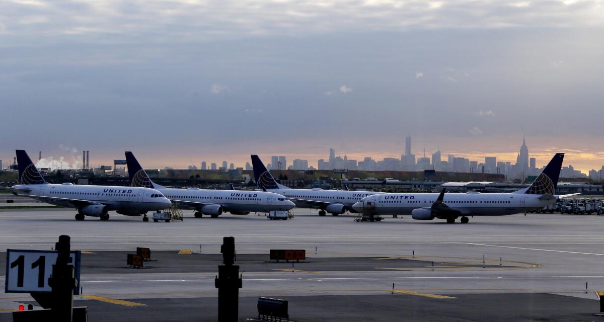 United Airlines jets parked at Newark, N.J., Liberty International Airport with the Manhattan skyline in the background. A woman has sued United, saying she was shortchanged on purchased Wi-Fi.