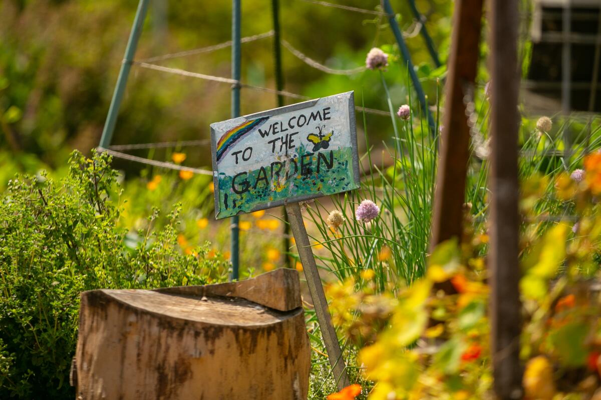 A welcome sign at Good Earth Community Garden on Friday.