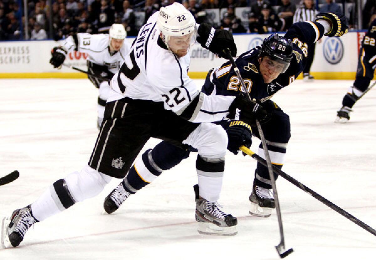 Kings center Trevor Lewis unleashes a shot against Blues left wing Alexander Steen during a game last month in St. Louis.