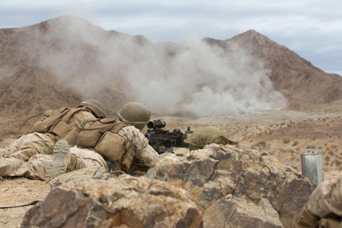 U.S. Marines fire a machine gun at targets at Marine Corps Air Ground Combat Center Twentynine Palms