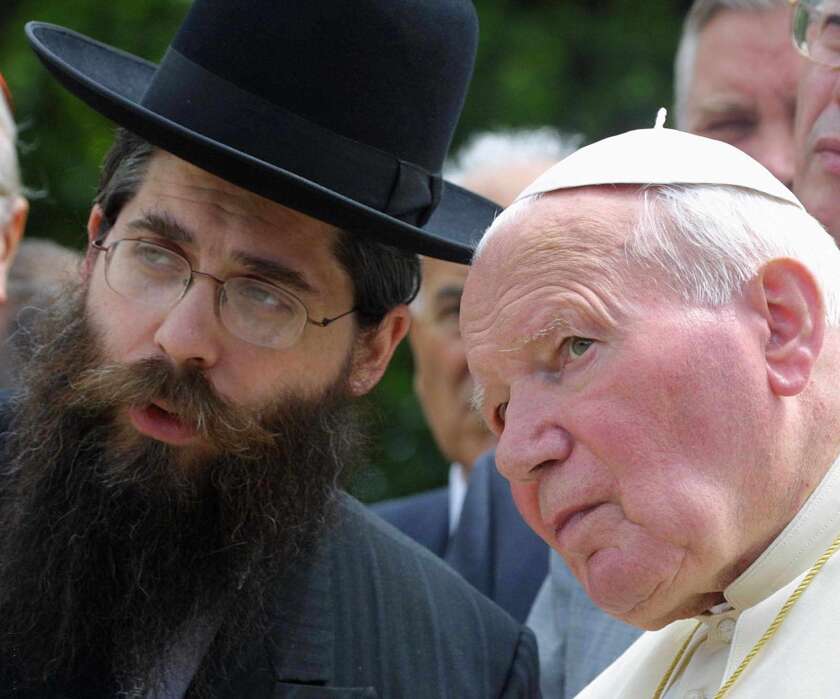 Pope John Paul II prays with Rabbi Yaakov Dov Bleich, Chief Rabbi of Kiev, in front of the Babi Yar memorial in homage of the 100,000 Ukrainian Jews and others who were lined up and shot in a ravine between 1941 and 1943. The pope called the massacre "one of the most violent crimes" of the 20th century.