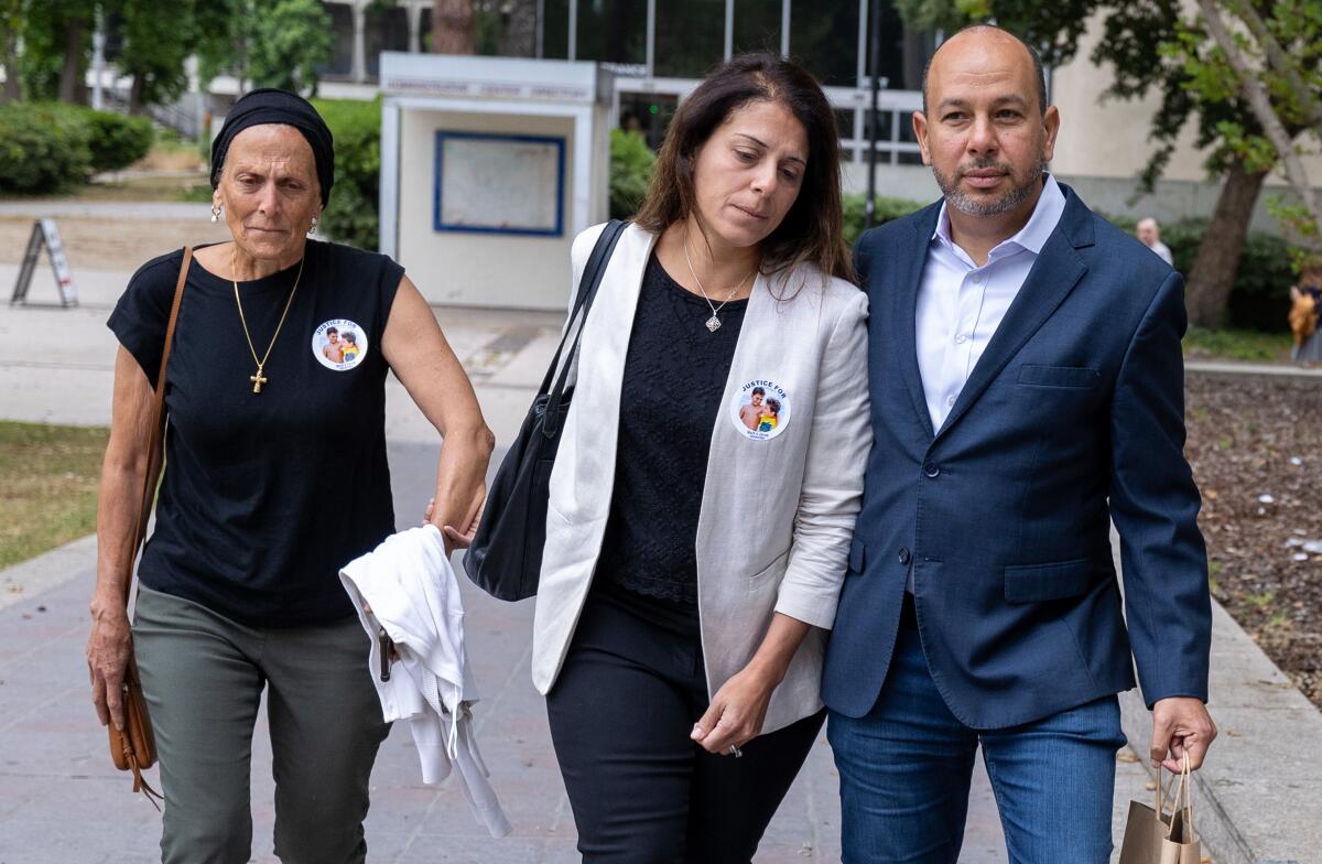 Karim Iskander, right, and wife Nancy Iskander, center, arrive for Rebecca Grossman's sentencing on Monday in Van Nuys.