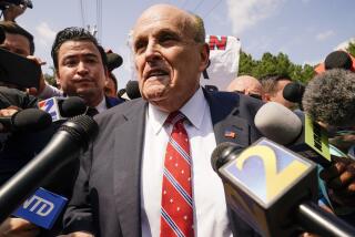 Rudy Giuliani speaks outside the Fulton County jail, Wednesday, Aug. 23, 2023, in Atlanta. Giuliani has surrendered to authorities in Georgia to face an indictment alleging he acted as former President Donald Trump’s chief co-conspirator in a plot to subvert the 2020 election. (AP Photo/Brynn Anderson)