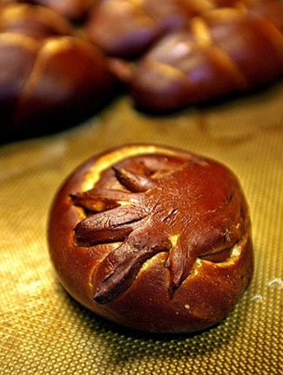 A handprint-topped Got Kosher? Rosh Hashana loaf.
