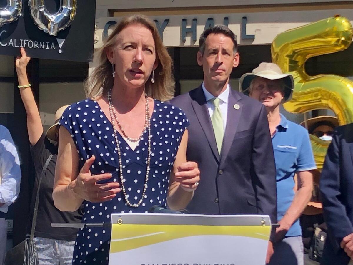 Encinitas Mayor Catherine Blakespear, with Encinitas City Council member Joe Mosca in the background.
