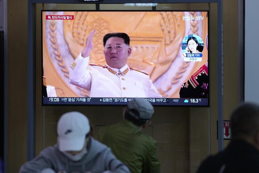 People watch a TV screen showing a news program reporting about North Korea's missile launch with file footage of North Korean leader Kim Jong Un at a train station in Seoul, South Korea, Thursday, May 12, 2022. South Korea says North Korea has fired a total of three short-range ballistic missiles toward the sea. South Korea's Joint Chiefs of Staff says the three missiles launched from the North's capital region on Thursday afternoon flew toward the waters off the country's eastern coast. (AP Photo/Lee Jin-man)