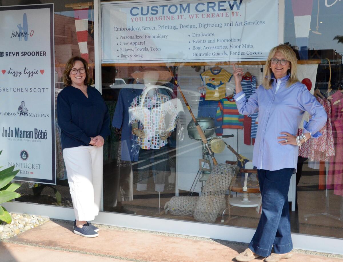 Michele McCormack, left, and Kathy Hill outside Crews Quarters Newport/Love Letters nautical store.