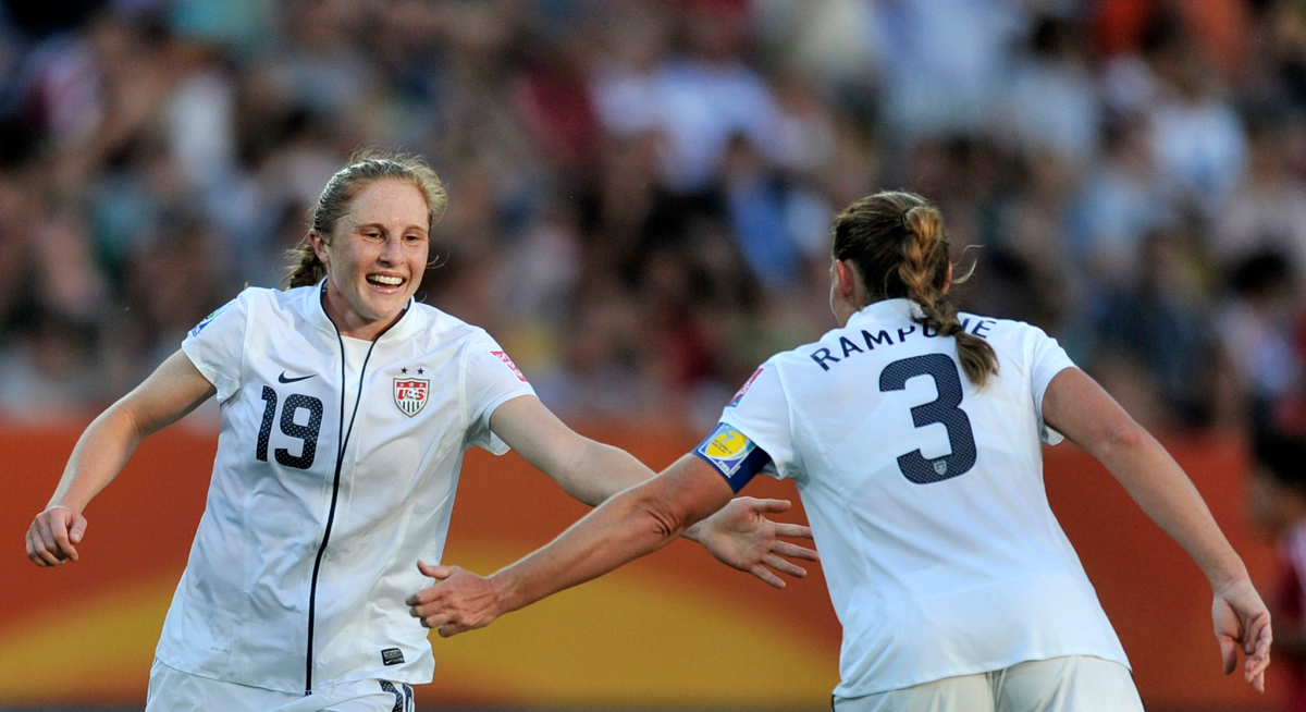 USA defender Rachel Buehler, left, celebrates with teammate Christie Rampone.