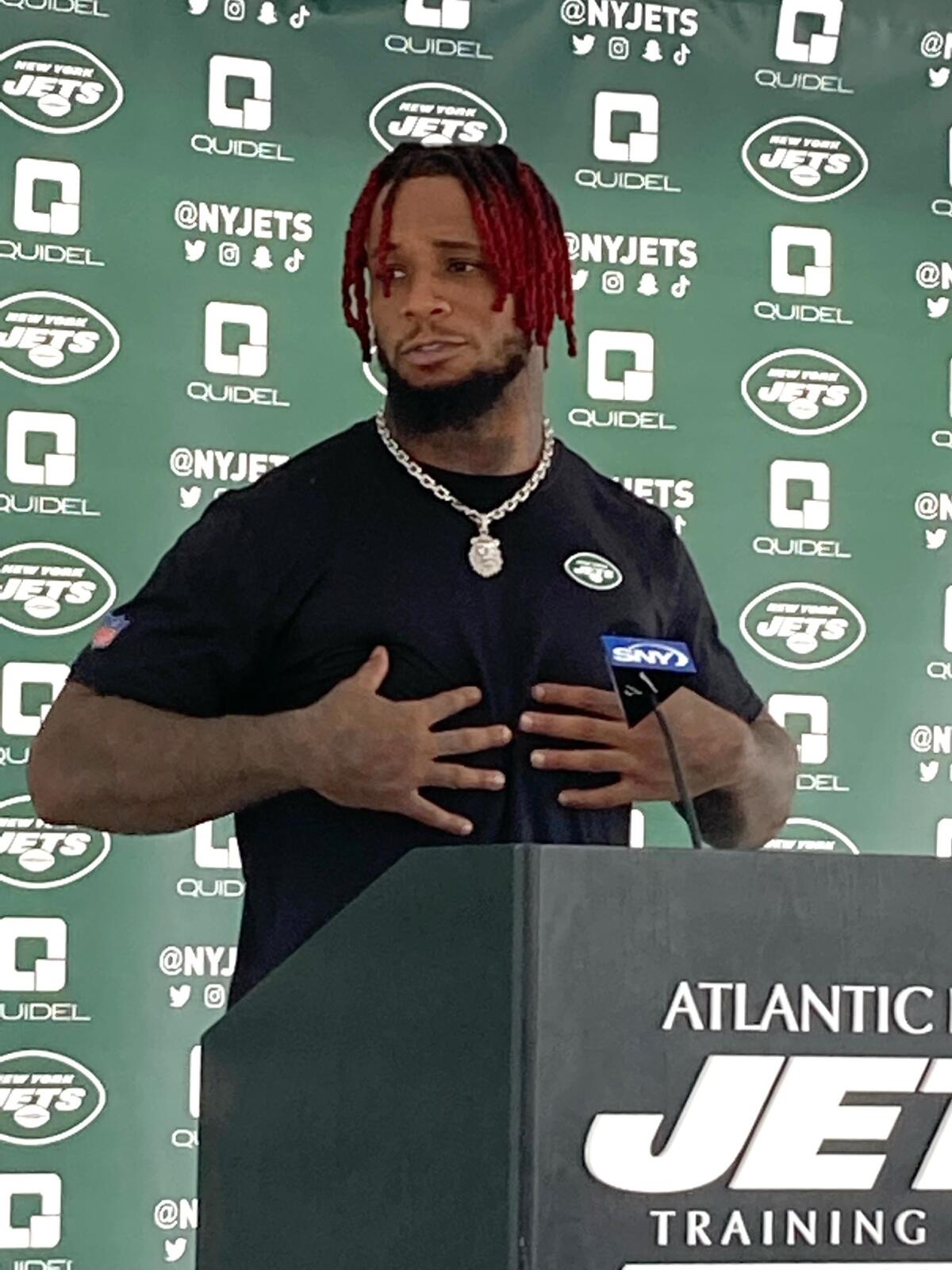 New York Jets linebacker Kwon Alexander speaks to reporters at the team's NFL football training facility in Florham Park, N.J., on Monday, Aug. 1, 2022. (AP Photo/Dennis Waszak Jr.)