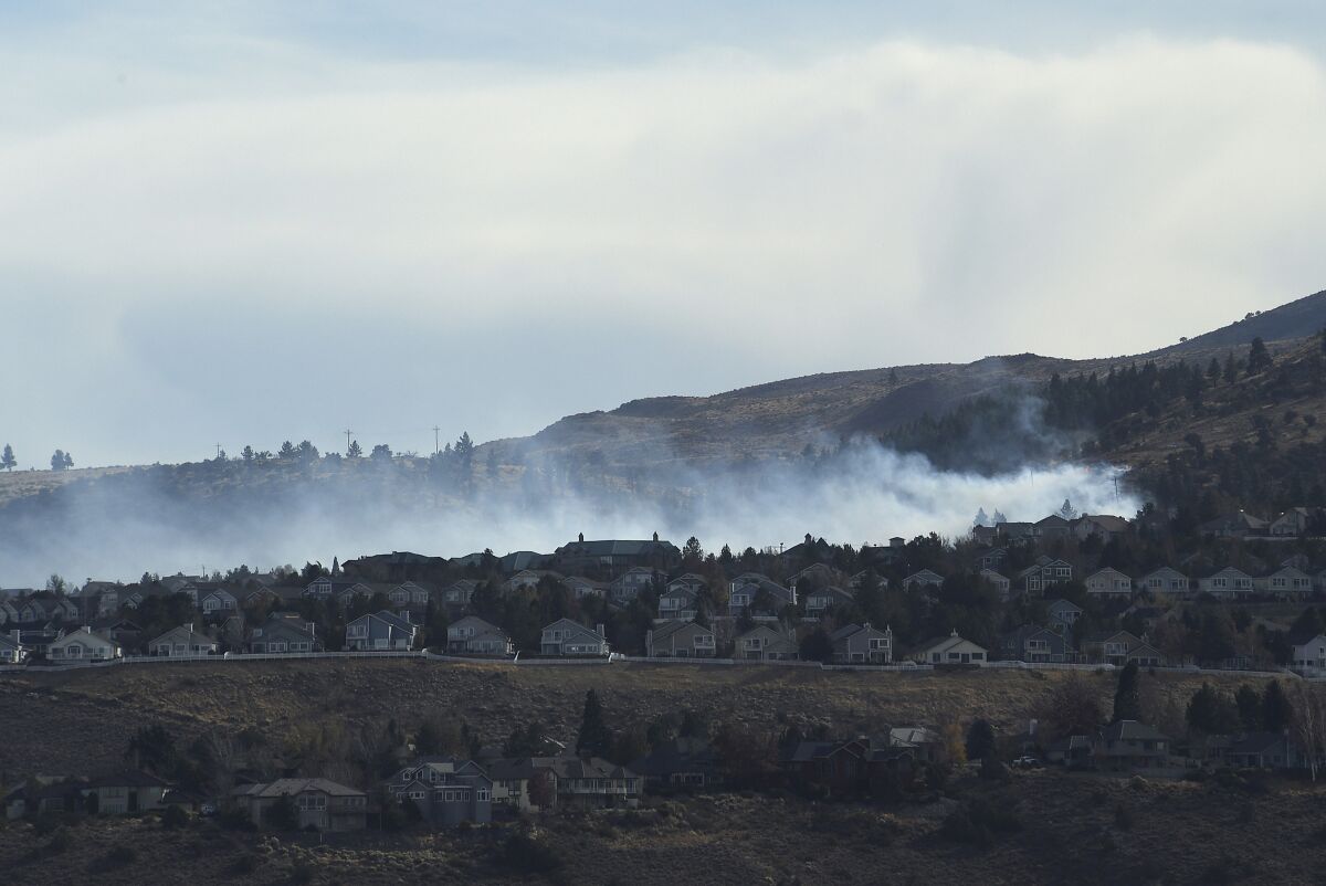 Fire burning in the Caughlin Ranch area of Reno on Tuesday