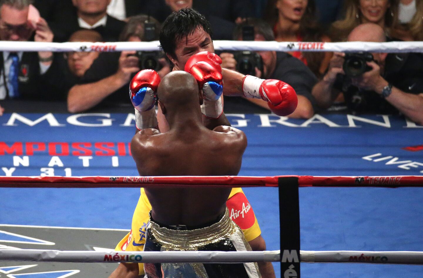 Manny Pacquiao fires away at Floyd Mayweather Jr. during the third round.