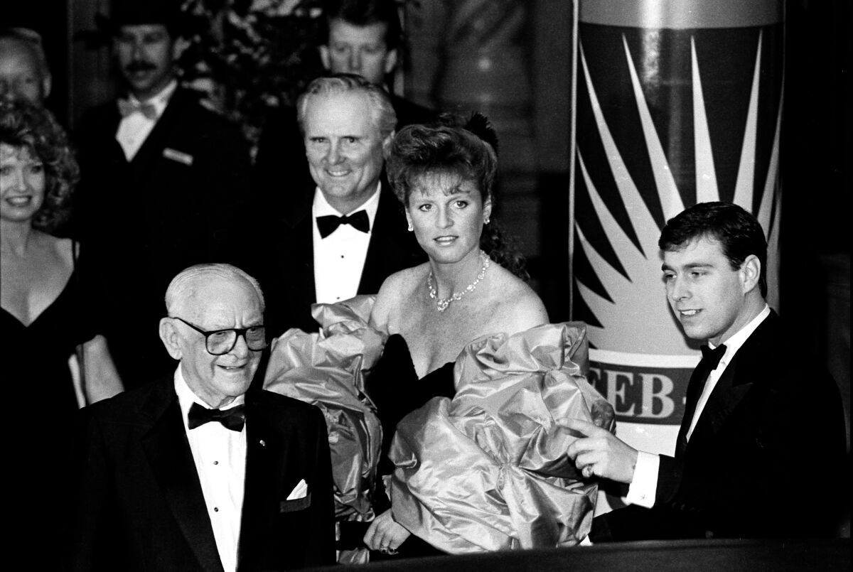 Lodwrick Cook, back center, with Sarah Ferguson and her husband, Prince Andrew, at a 1988 gala.