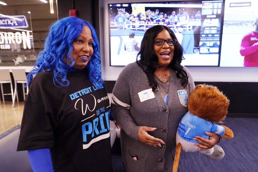 Detroit Lions fans Verdell Blackmon, left, and her daughter A.J. Brown are interviewed before an NFL football game between the Minnesota Vikings and Lions, Sunday, Dec. 5, 2021, in Detroit. More than half of the NFL's 32 teams have female fan clubs. The Detroit Lions' Women of the Pride group is one of them. Blackmon showed up for a recent game and left no doubt who she was cheering for that afternoon. She was one of about 50 female fans in the group who attended a pregame party at Ford Field. (AP Photo/Carlos Osorio)
