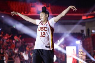 USC freshman JuJu Watkins waves to the crowd during the Trojan HoopLA event at Galen Center on Oct. 19