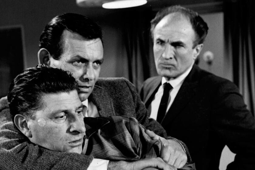 1967 file photo of William Raisch, the onearmed man; David Janssen and Barry Morse in an episode from "The Fugitive"