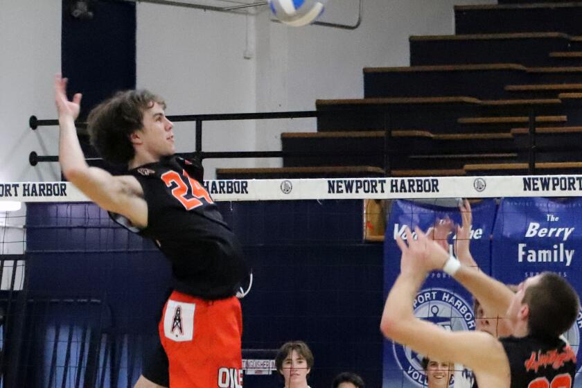Huntington Beach's Nick Gainer (24) spikes the ball during Huntington Beach High School boys' volleyball team against Newport Harbor High School boys volleyball team in a pool-play game of the CIF Southern Section Division 1 boys' volleyball playoff game at Newport Harbor High School in Newport Beach on Tuesday, April 30, 2024. (Photo by James Carbone)