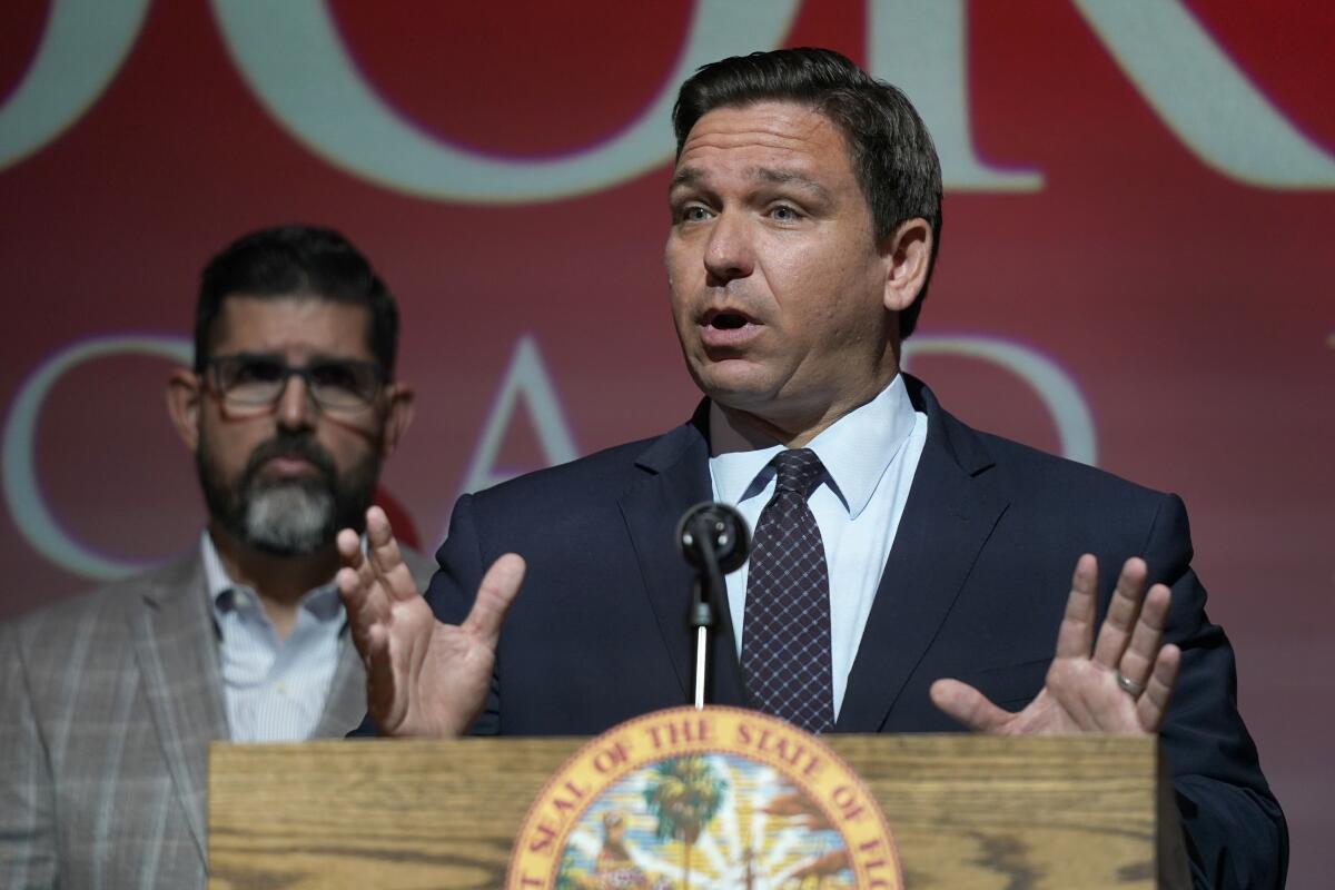 Florida Gov. Ron DeSantis delivers a speech at a lectern.