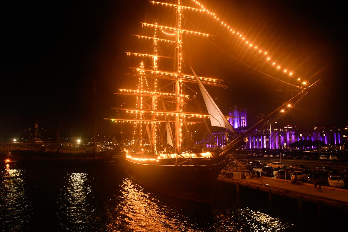 A ship is covered in lights in San Diego.