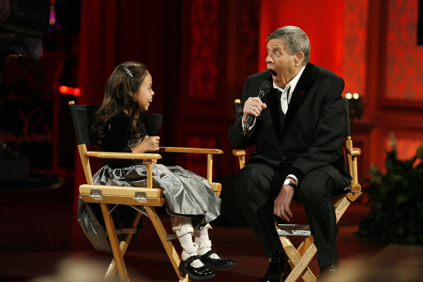 Jerry Lewis jokes with Abby Umali, 9, during the 2008 telethon in Las Vegas.