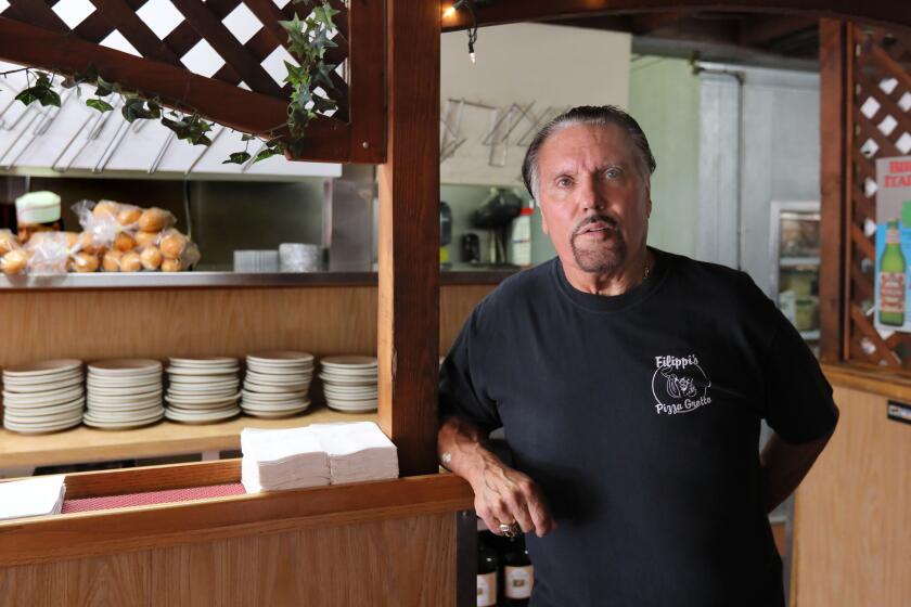 September 21, 2018_Escondido, California_USA_| Bobby DePhilippis, owner of Filippi's Pizza Grotto, is against a plan the City has to turn a nearby parking lot where most of his customers park to a large condo complex. |_Photo Credit: Photo by Charlie Neuman