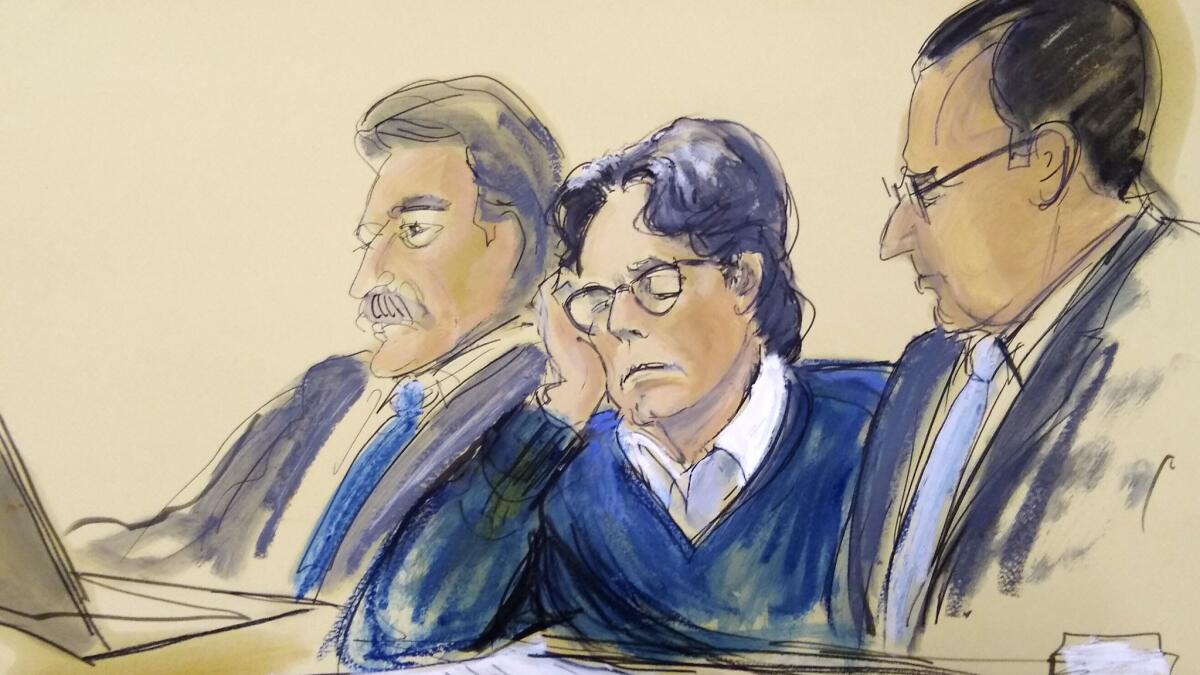 A courtroom artist's sketch shows defendant Keith Raniere, center, sitting with attorneys Paul DerOhannesian, left, and Marc Agnifilo during closing arguments at Brooklyn federal court in New York on Tuesday.