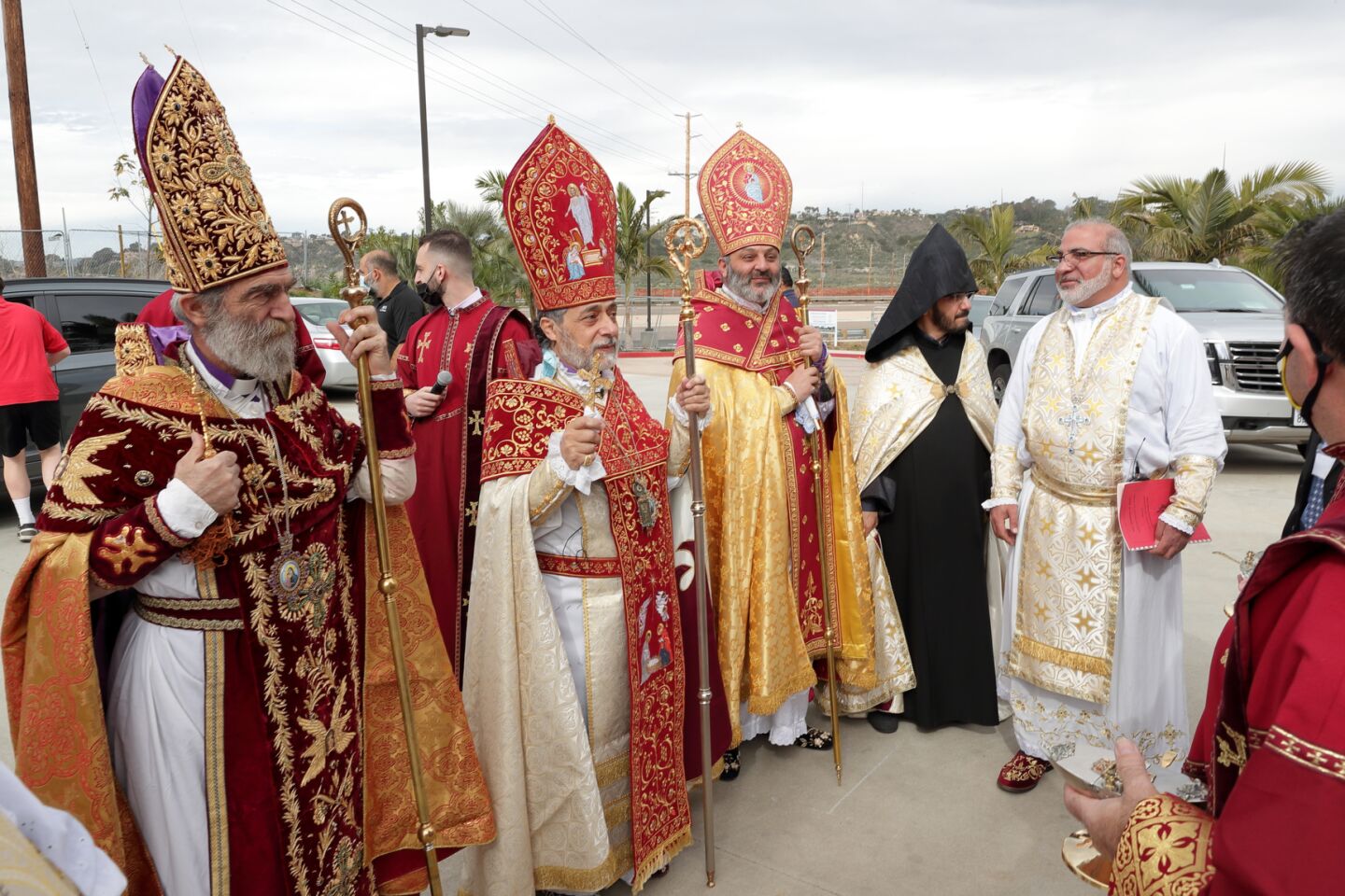 Archbishop Barkev Martirosyan (Former Primate of Artsakh, Armenia), Archbishop Hovnan Derderian (Primate, Western Diocese of Armenian Church), Bishop Bagrat Galastanyan (Primate of the Diocese of Tavush, Armenia), and Father Pakrad Berejekian (Parish Priest, far right in white robe) prepare to preside over the consecration and church naming ceremony at the new Armenian Church in San Diego.