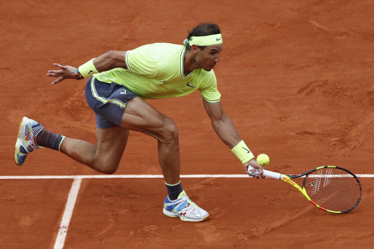 Spain's Rafael Nadal reaches for the ball as he plays Austria's Dominic Thiem.