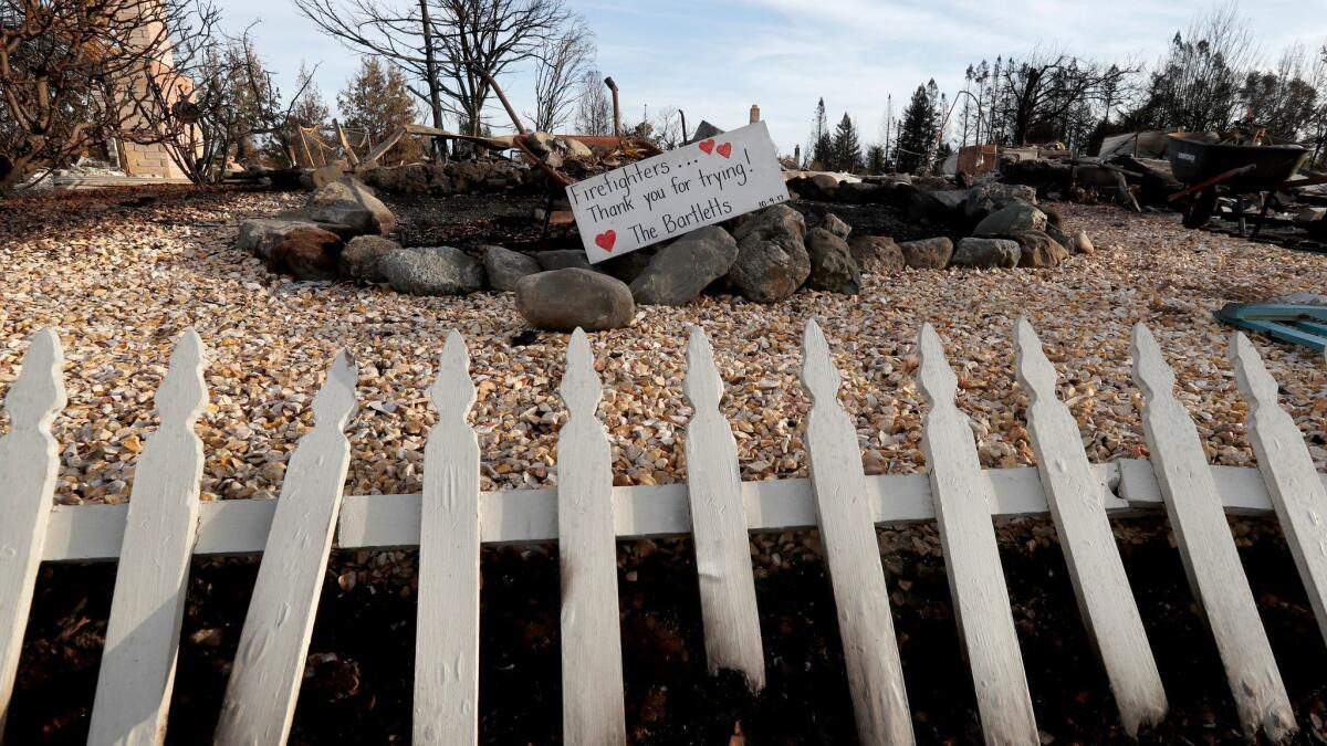 A sign thanks firefighters for their effort at a burned home in Coffey Park.