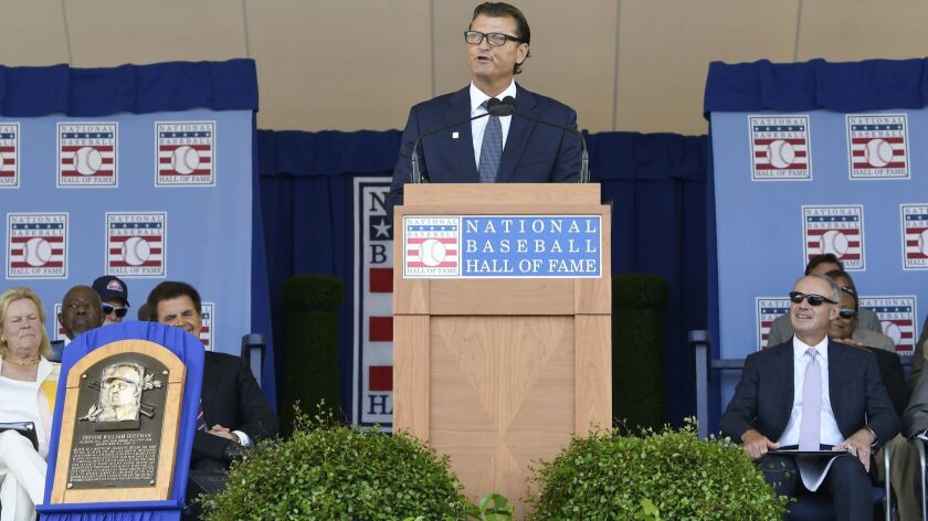 National Baseball Hall of Fame inductee Trevor Hoffman, center, speaks during an induction ceremony at the Clark Sports Center on Sunday, July 29, 2018, in Cooperstown, N.Y.