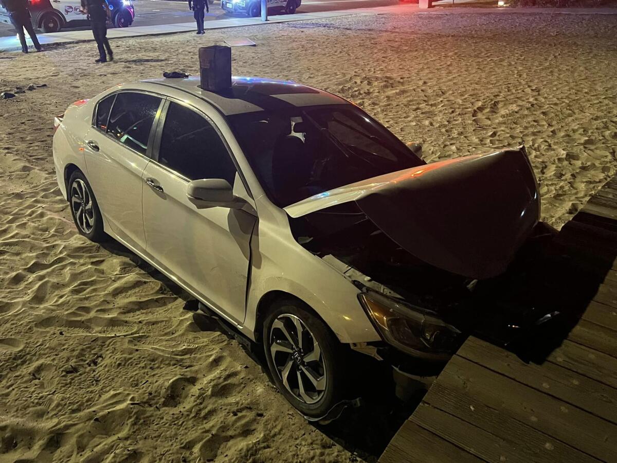 The driver of a sedan that crashed into the boardwalk at Main Beach in Laguna Wednesday was arrested on suspicion of DUI.