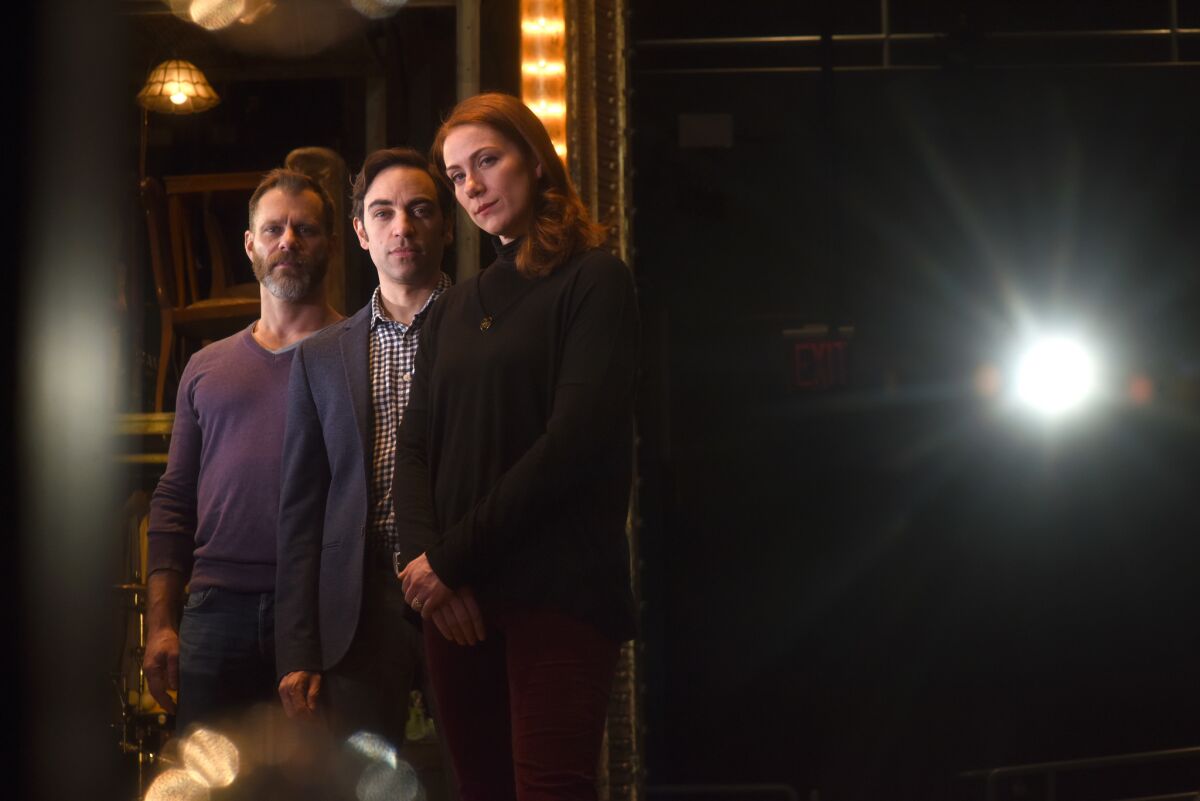 Director Noah Brody, left, and actors Ben Steinfeld and Jessie Austrian, founders of Fiasco Theater, on the set of "Merrily We Roll Along" in New York