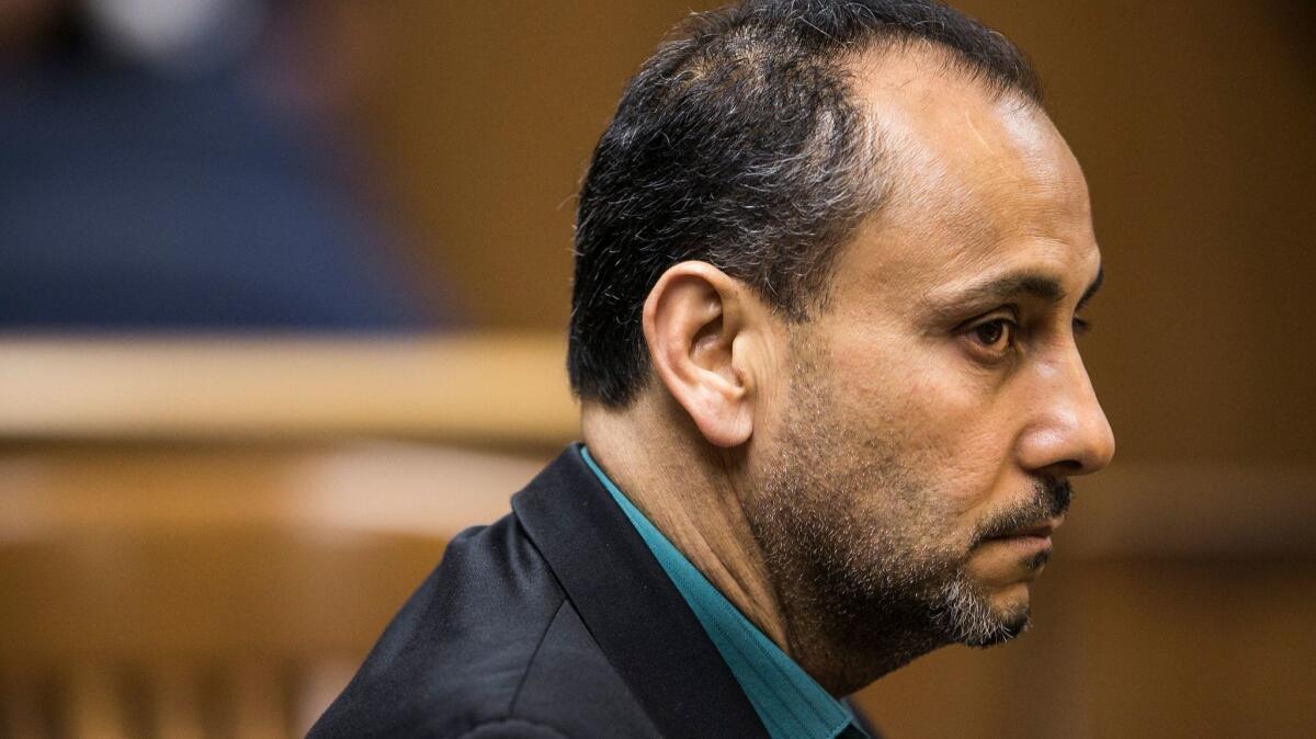 Morrad Ghonim appears in court on charges of hiring a man to stage a robbery and kill his wife in 1992.