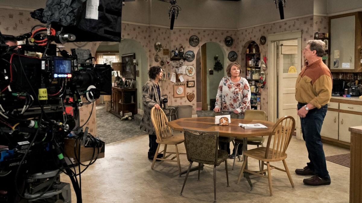 "Roseanne" cast members, from left, Sara Gilbert, Roseanne Barr and John Goodman work last year on the set of the now-canceled ABC show.