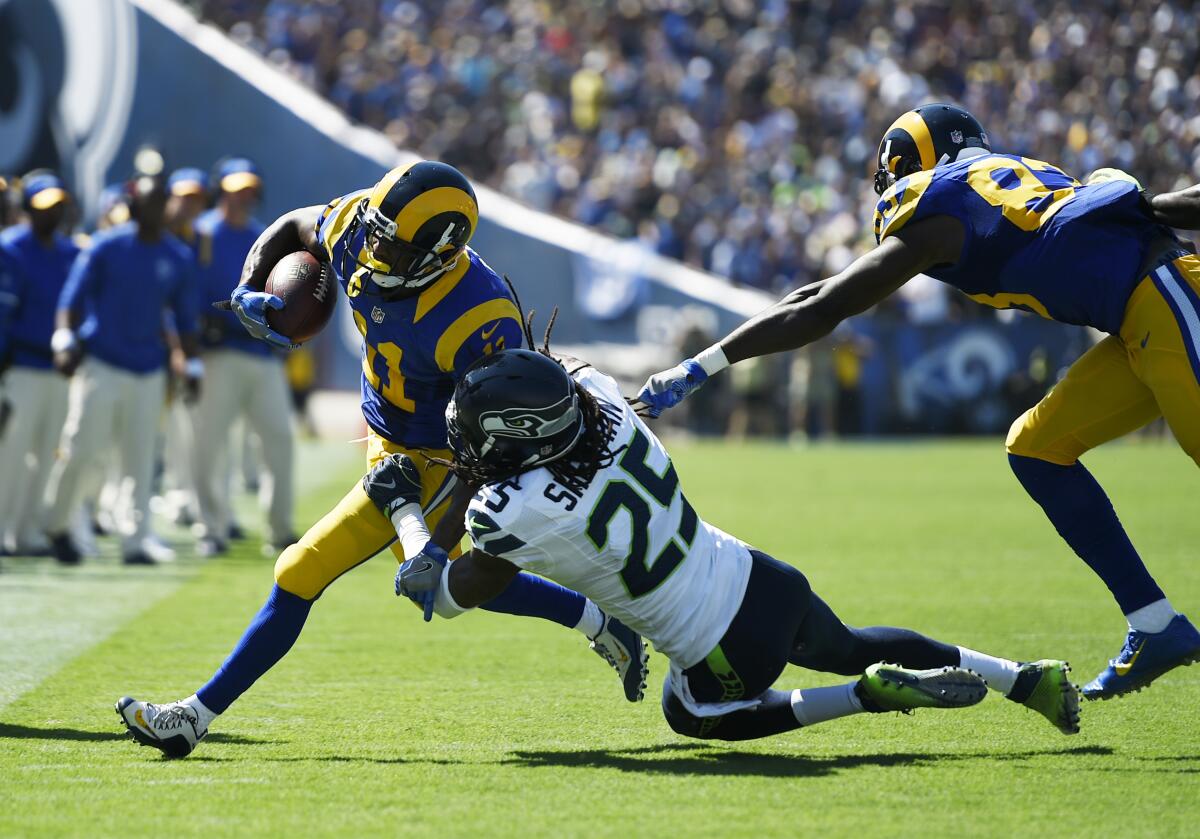 Rams  receiver Tavon Austin (11)  is forced out of bounds by Seattle cornerback Richard Sherman (25) in 2016.
