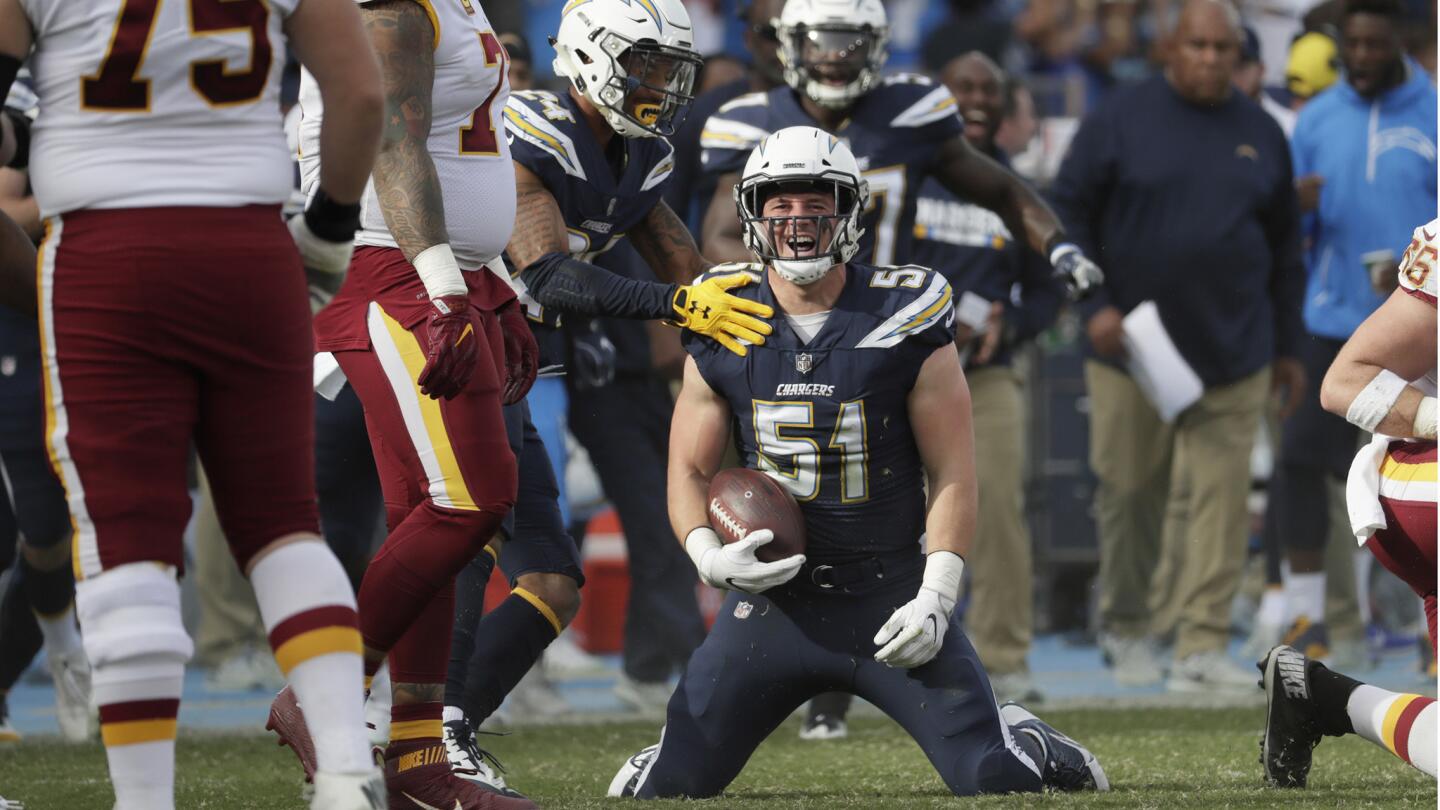Chargers linebacker Kyle Emmanuel celebrates after intercepting a pass by Redskins quarterback Kirk Cousins during the first quarter.